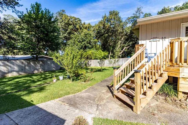 a view of a chair with wooden fence