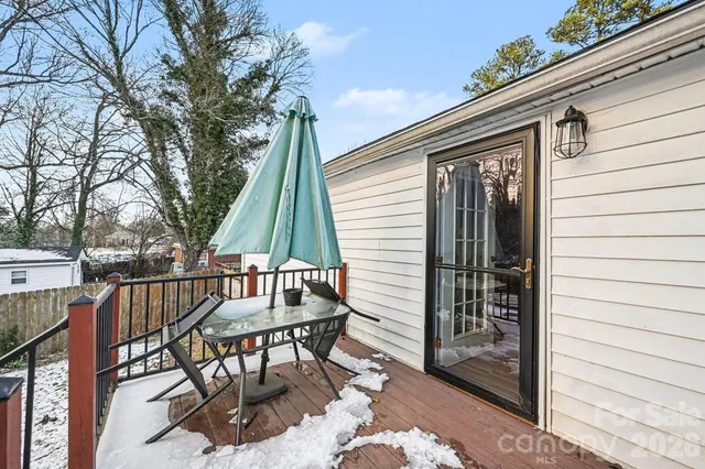 a view of backyard with a patio and outdoor seating
