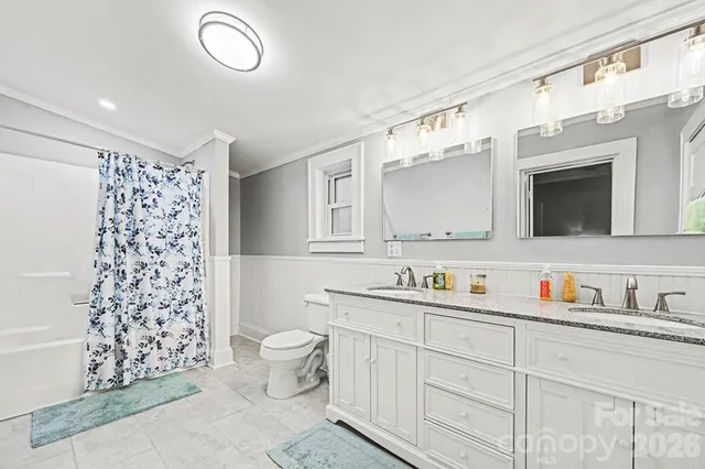 a bed room with a bed and a chair