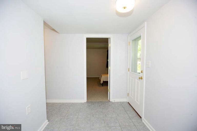 1801 Briggs Road Silver Spring, MD 20906 - Photo 3 of 30 a view of an empty room and a gallery