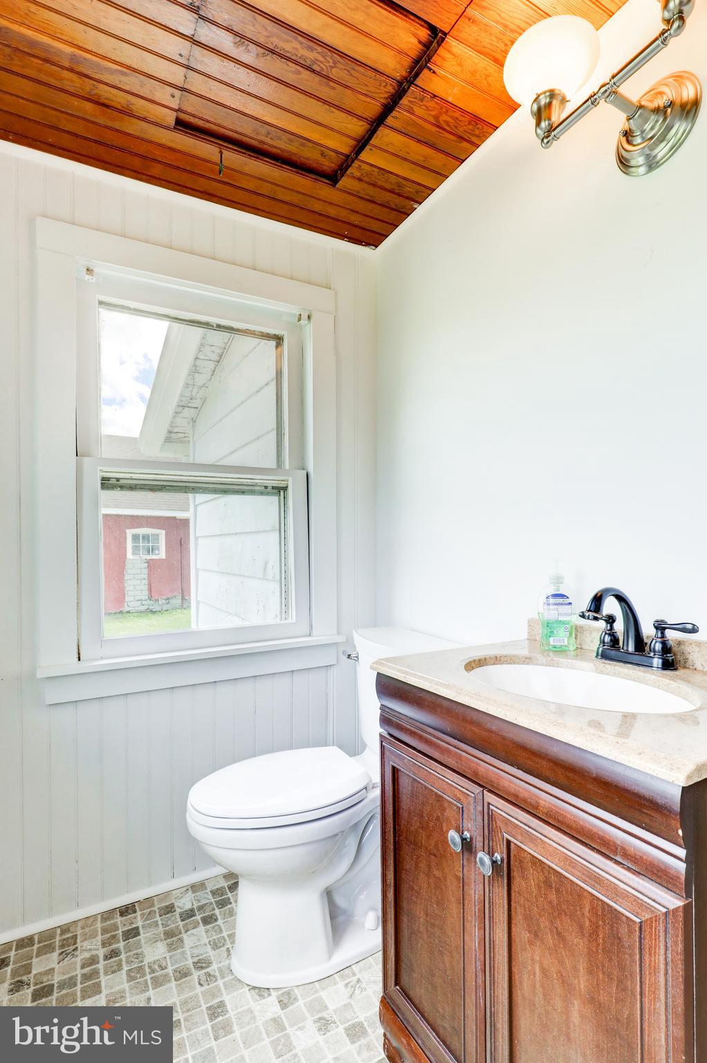 204 Roneys Corner Road Oxford, PA 19363 - Photo 15 of 33 a bathroom with a sink a toilet and a window