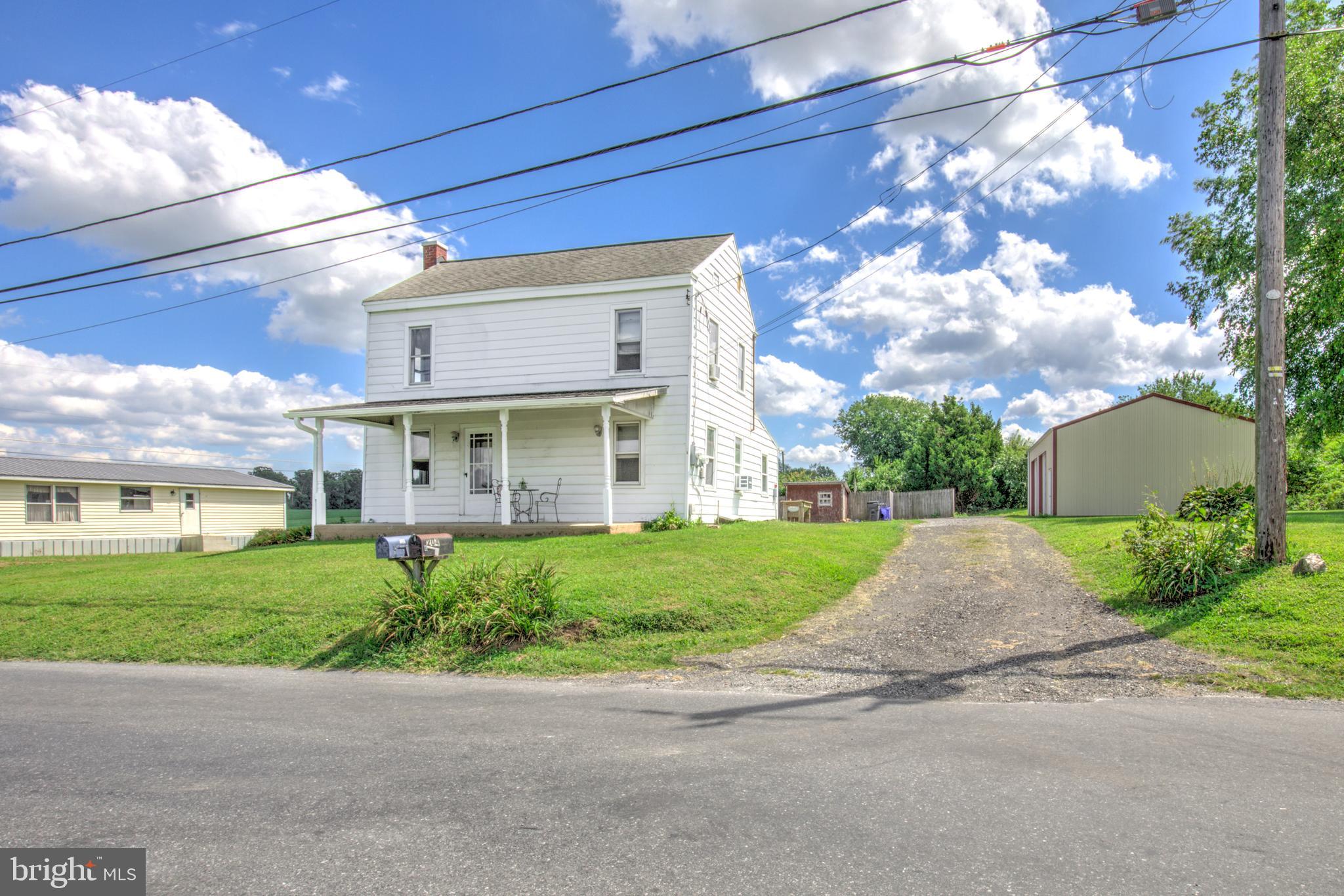 204 Roneys Corner Road Oxford, PA 19363 - Photo 2 of 33 a view of a brick house with a yard