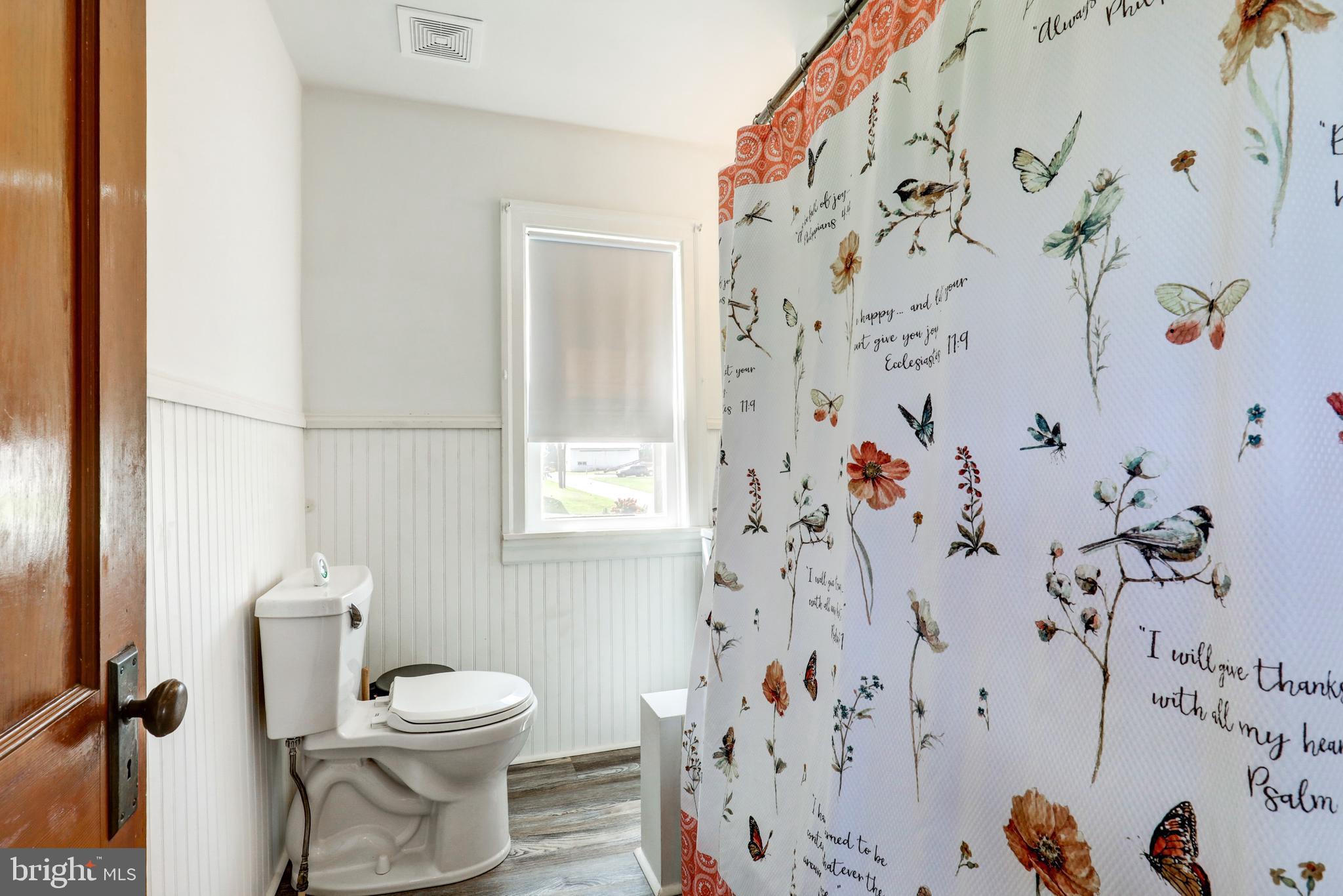 204 Roneys Corner Road Oxford, PA 19363 - Photo 21 of 33 a bathroom with a toilet and shower curtain