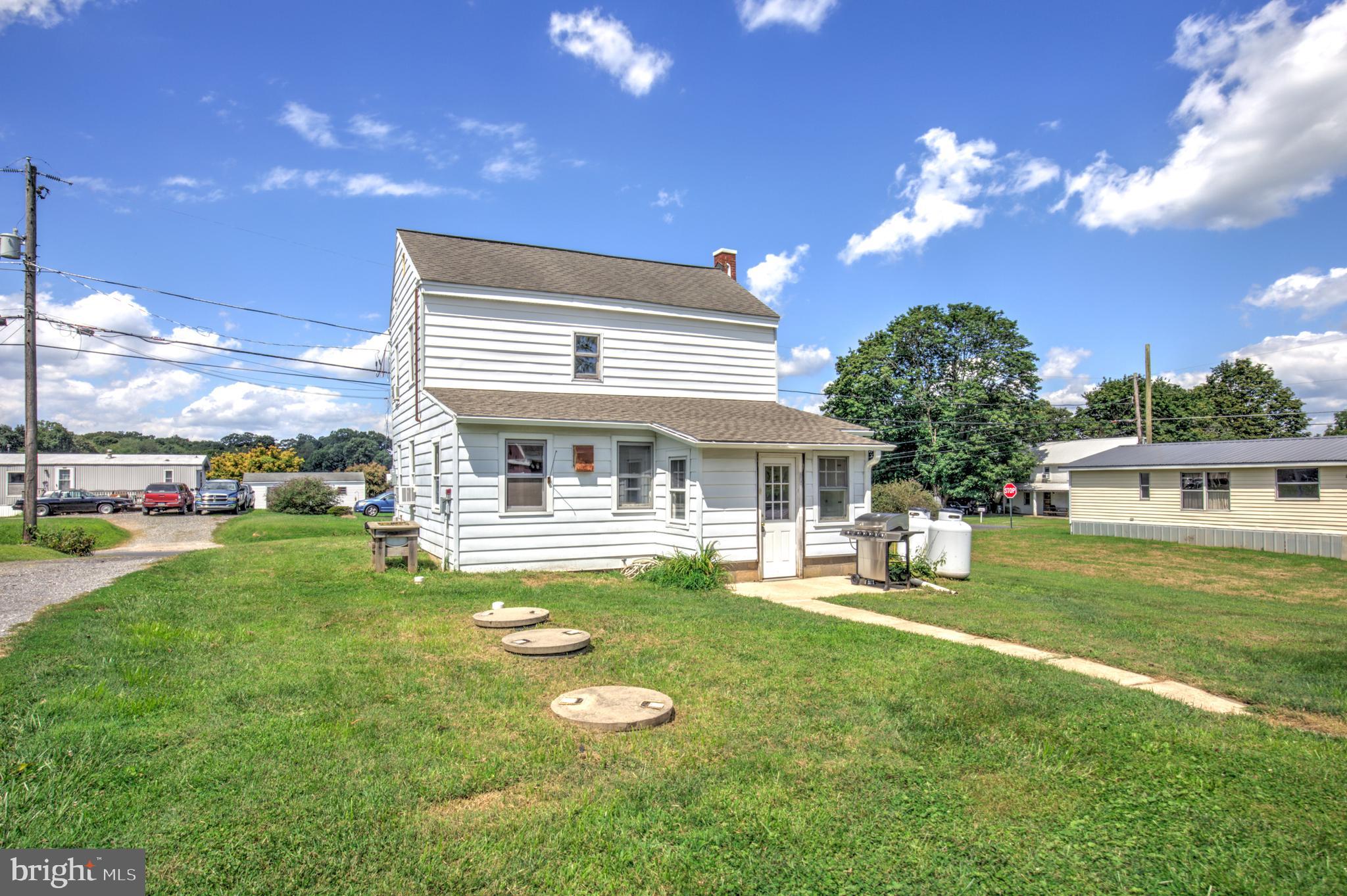 204 Roneys Corner Road Oxford, PA 19363 - Photo 33 of 33 a front view of house with yard and outdoor seating