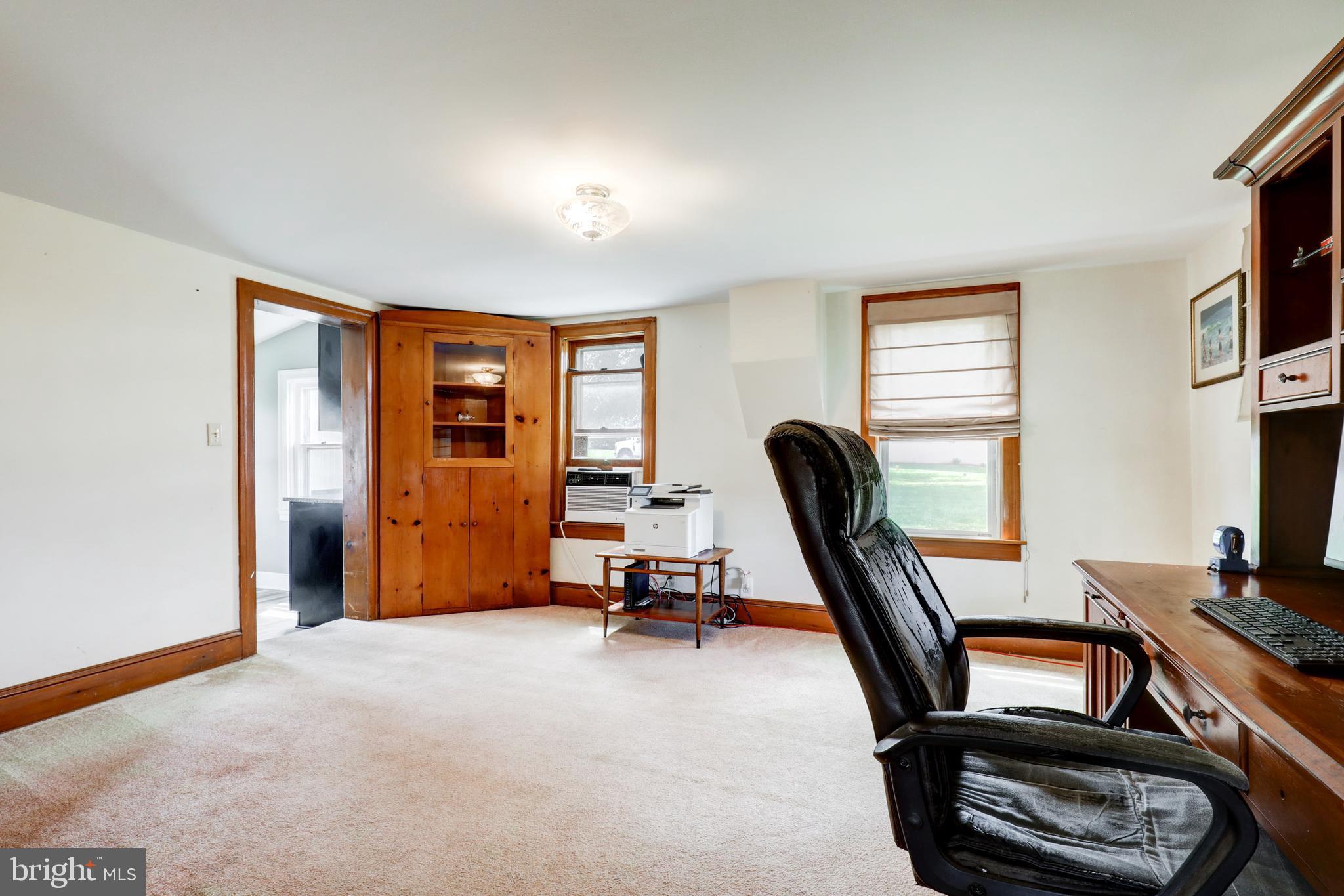 204 Roneys Corner Road Oxford, PA 19363 - Photo 9 of 33 a view of a workspace with furniture and a window