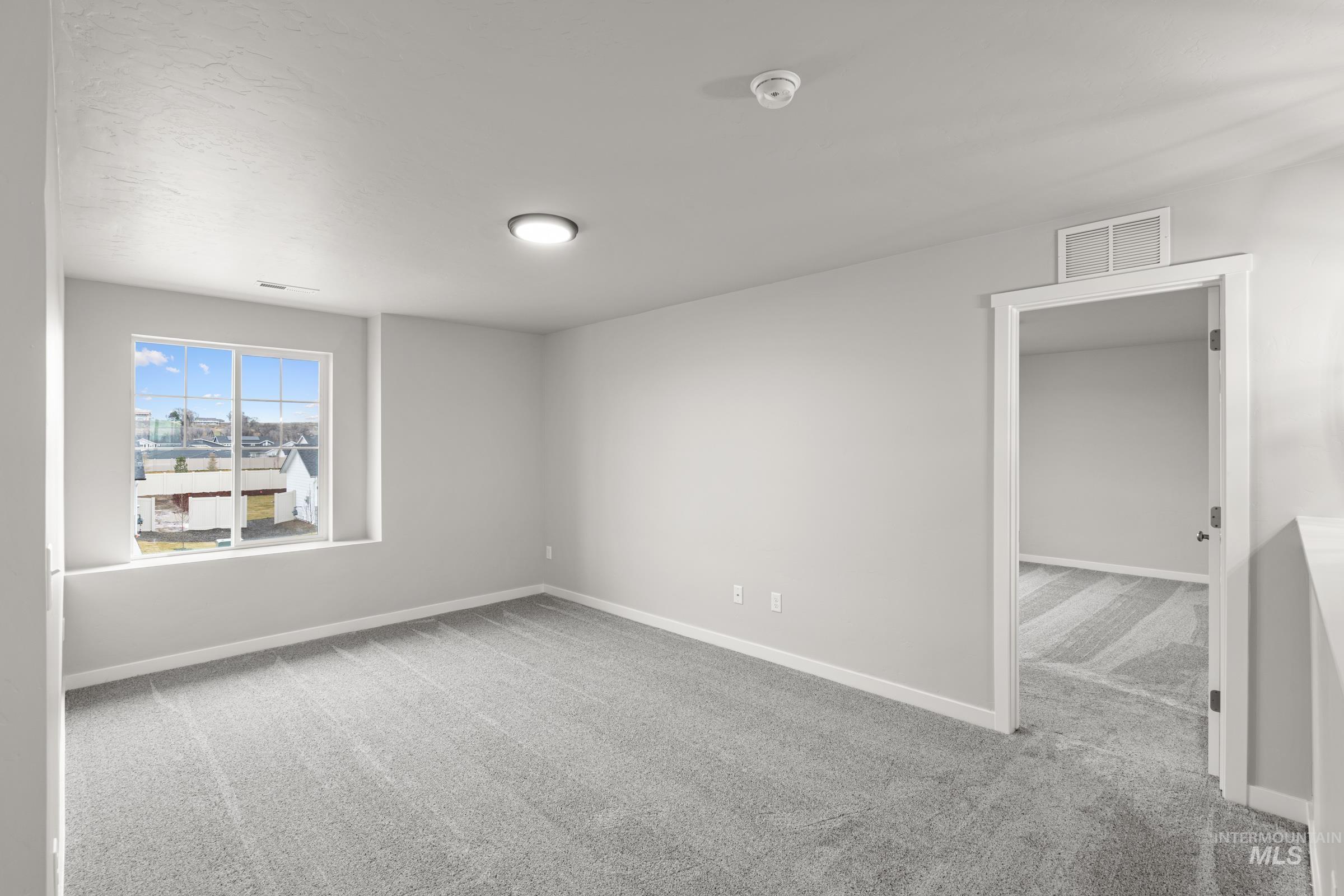 1651 Dyer Street Middleton, ID 83644 - Photo 14 of 28 Unfurnished room with light carpet and baseboards
