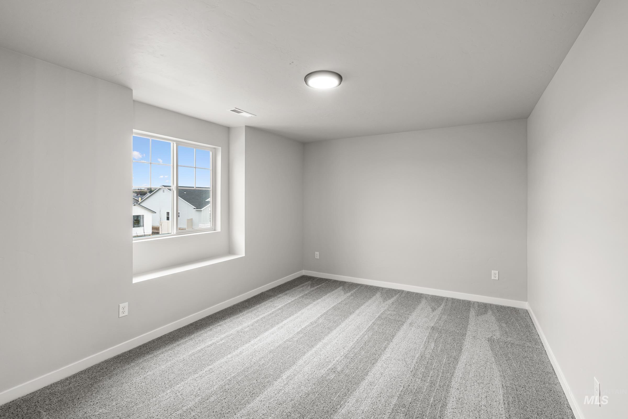 1651 Dyer Street Middleton, ID 83644 - Photo 16 of 28 Empty room featuring light carpet and baseboards