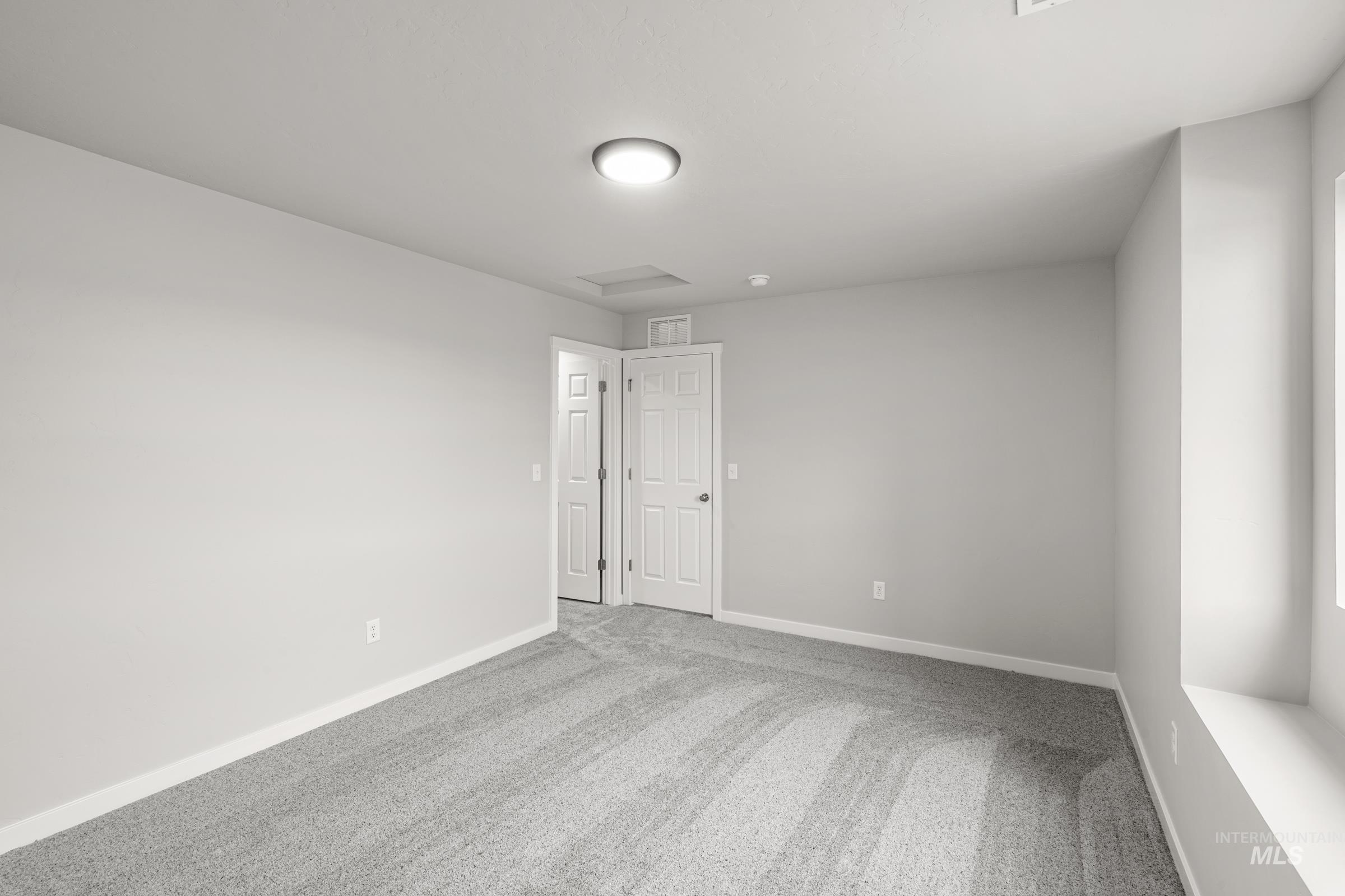 1651 Dyer Street Middleton, ID 83644 - Photo 17 of 28 Spare room with light carpet and baseboards