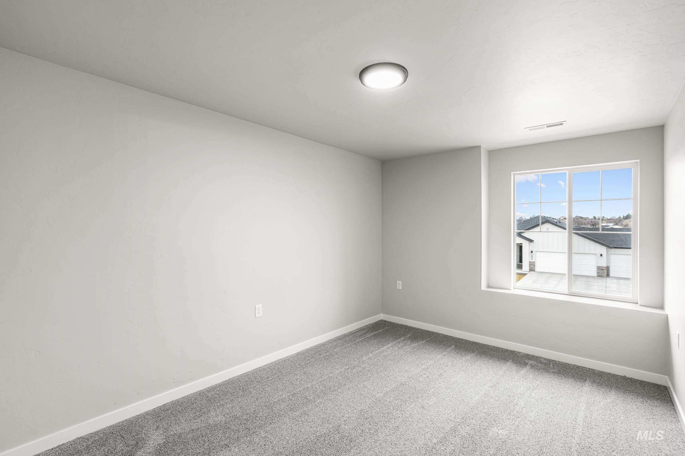 1651 Dyer Street Middleton, ID 83644 - Photo 18 of 28 Carpeted empty room with baseboards