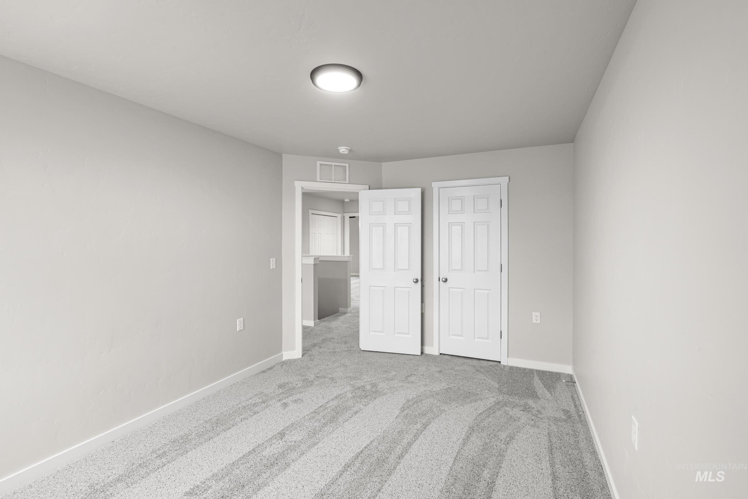 1651 Dyer Street Middleton, ID 83644 - Photo 19 of 28 Unfurnished bedroom with light carpet and baseboards