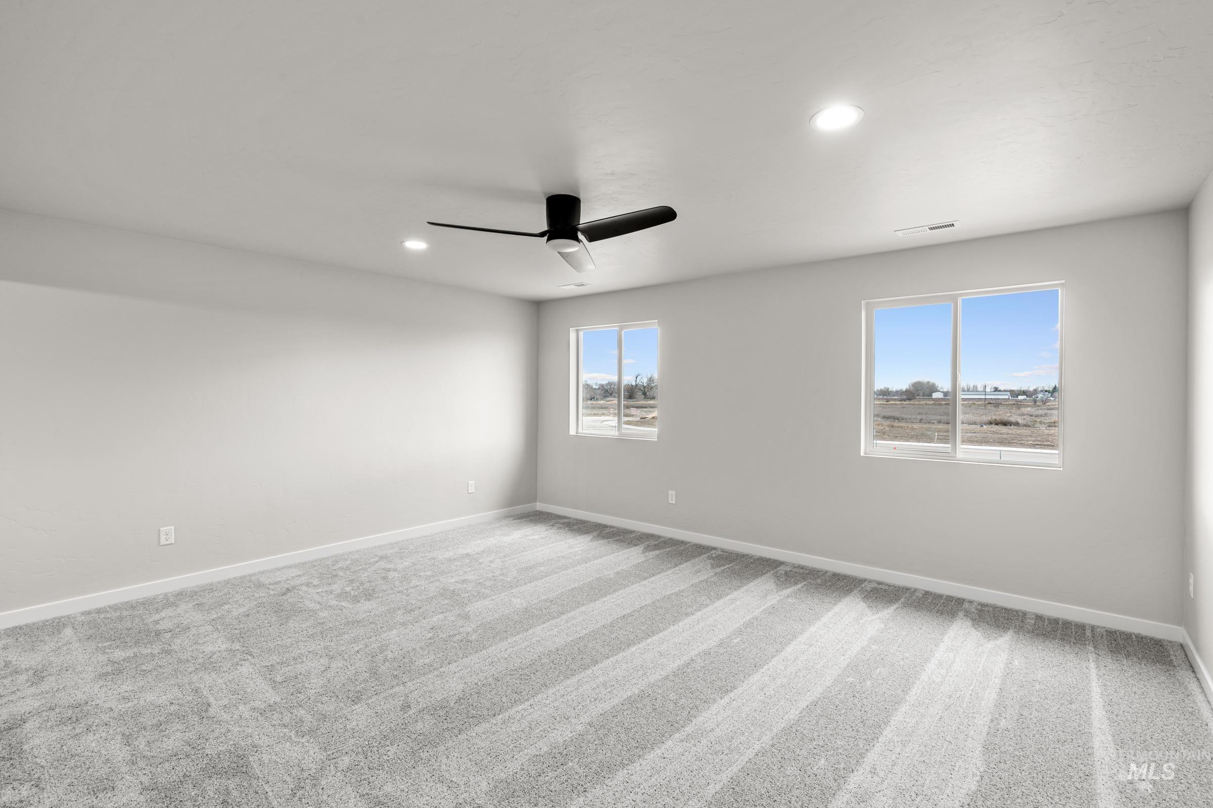 1651 Dyer Street Middleton, ID 83644 - Photo 22 of 28 Spare room with light carpet, ceiling fan, and recessed lighting