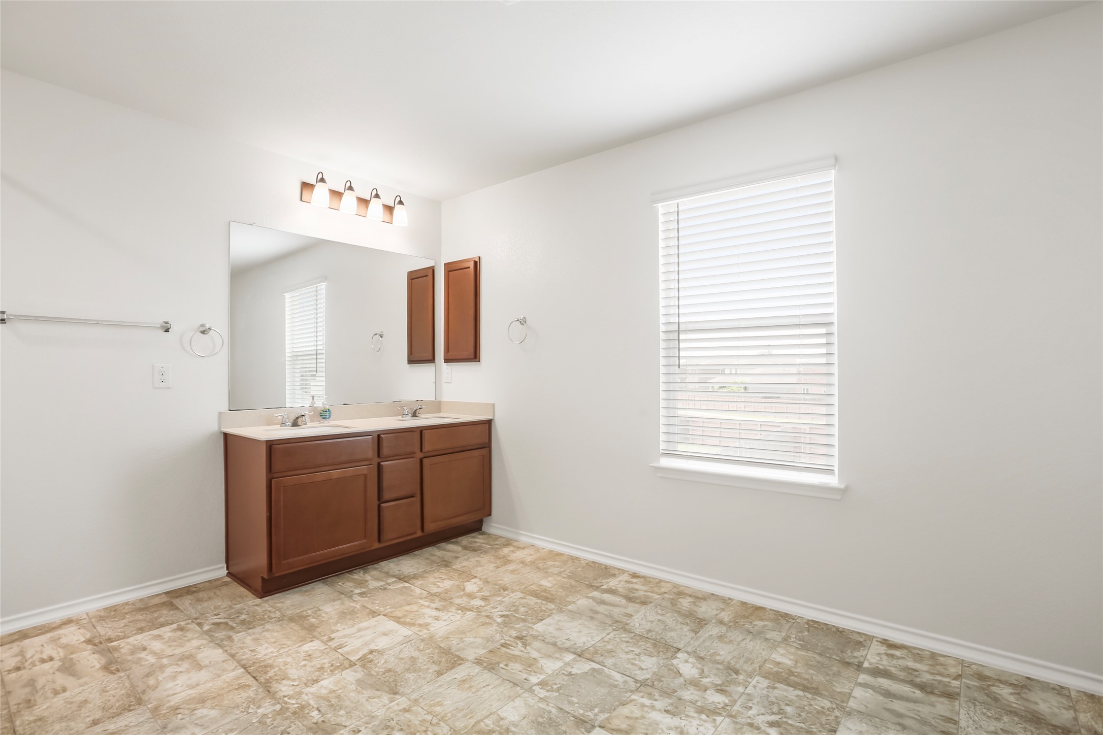 18917 Rushmore Street Manor, TX 78653 - Photo 17 of 28 a room with a cabinets and window
