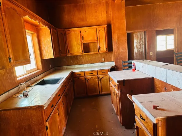 a view of a bathroom with a shower and a sink
