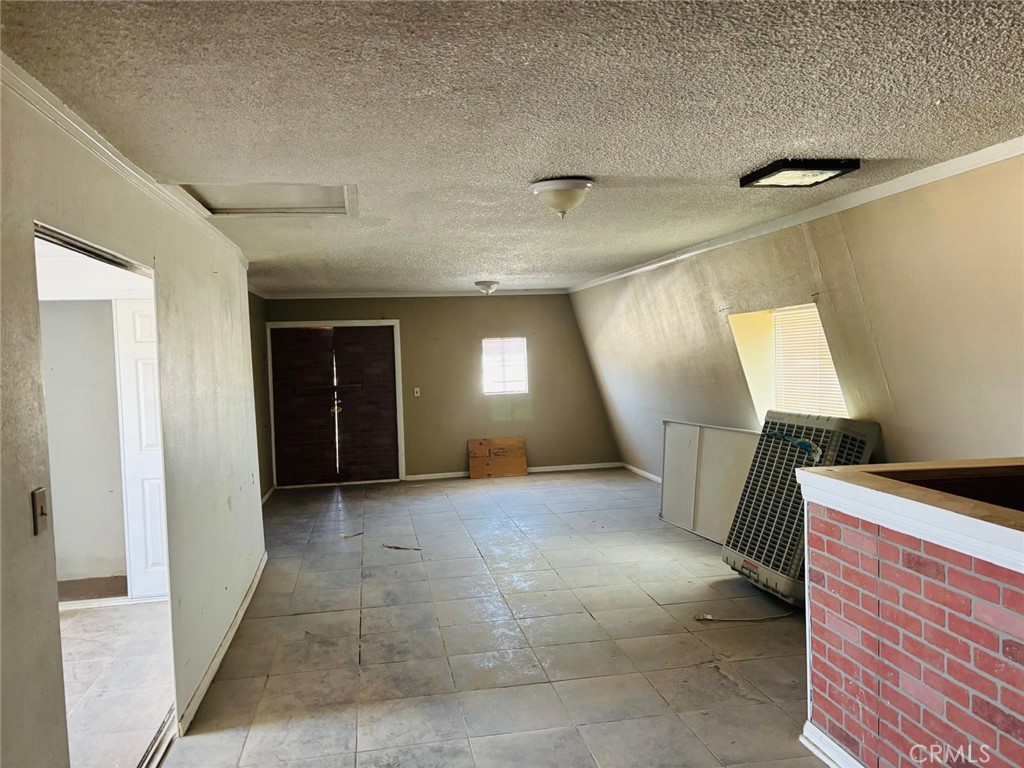 11690 Camp Rock Road Lucerne Valley, CA 92356 - Photo 13 of 33 a view of empty room with wooden floor