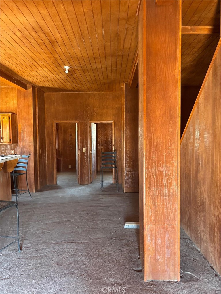 11690 Camp Rock Road Lucerne Valley, CA 92356 - Photo 17 of 33 a view of a hallway with wooden shelves