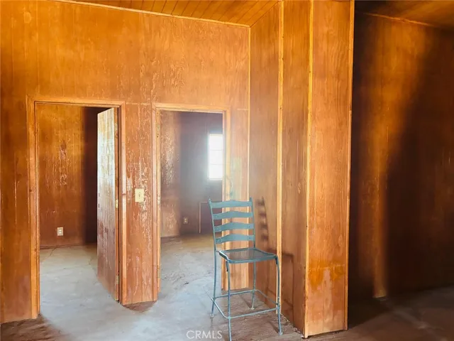 a view of staircase with wooden floor and lamp
