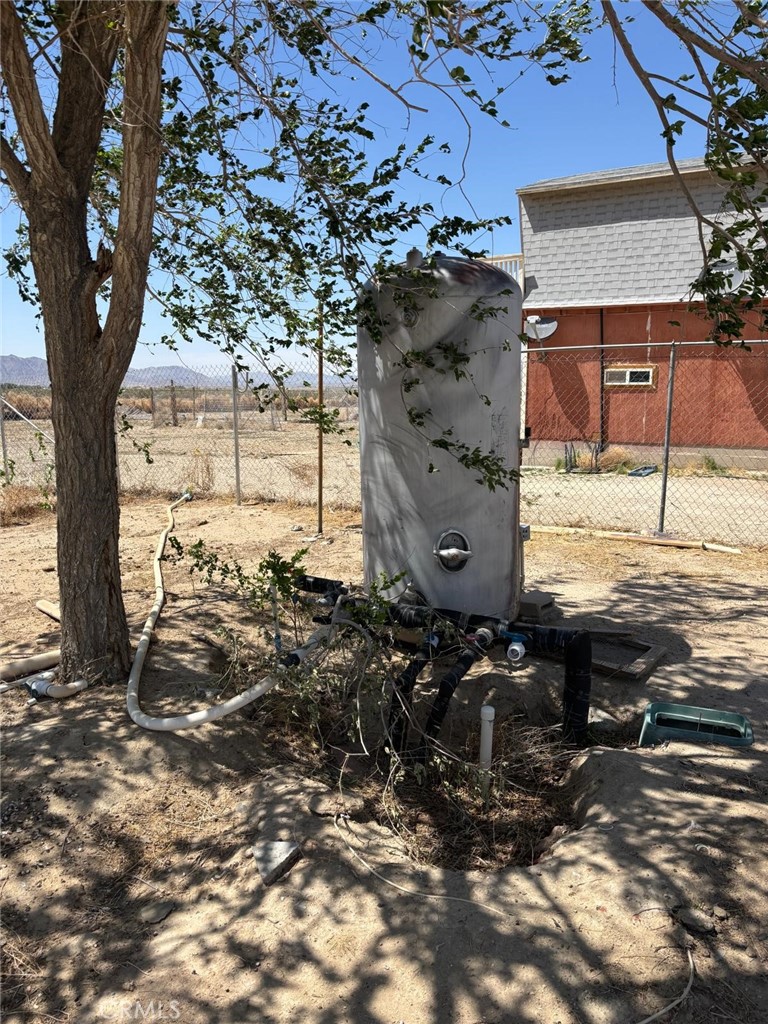 11690 Camp Rock Road Lucerne Valley, CA 92356 - Photo 22 of 33 an outdoor view of a house with a yard