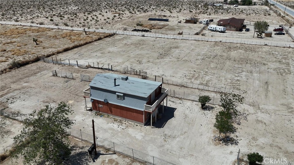 11690 Camp Rock Road Lucerne Valley, CA 92356 - Photo 3 of 33 view of a backyard with wooden fence