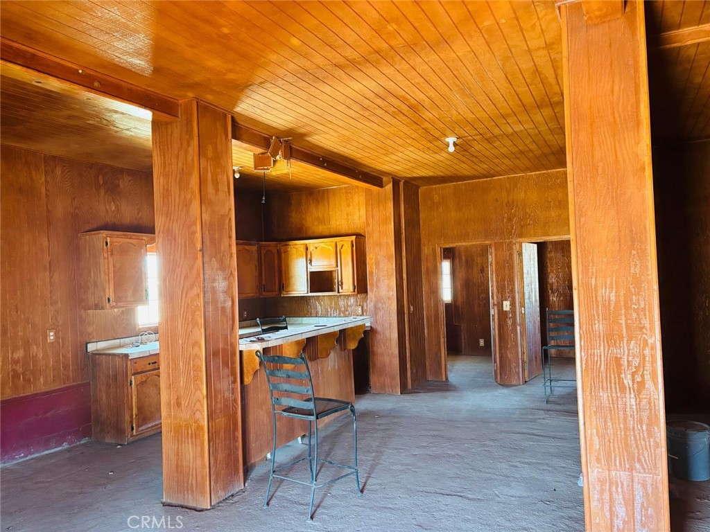 11690 Camp Rock Road Lucerne Valley, CA 92356 - Photo 6 of 33 a view of a hallway with wooden shelves
