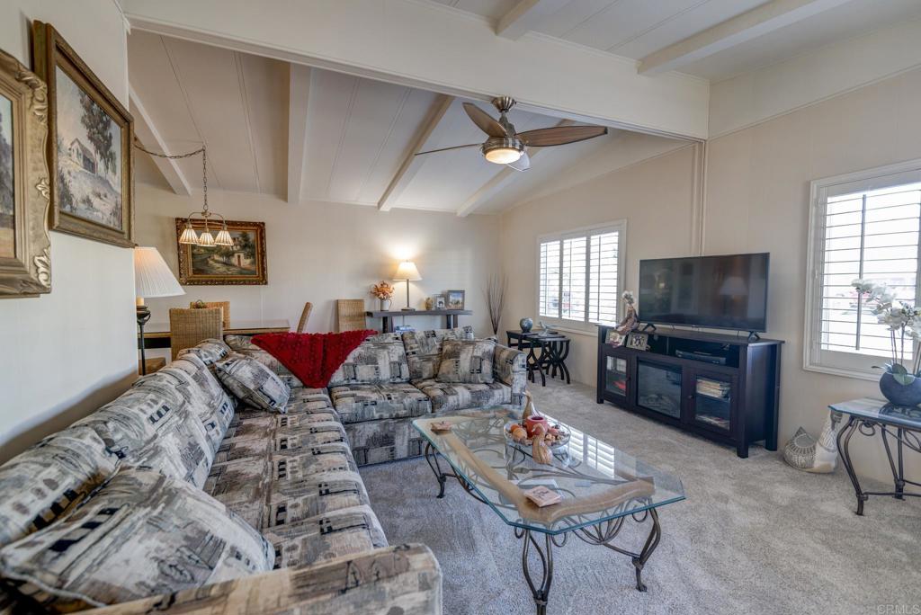 1010 Palm Canyon Drive, Unit 339 Borrego Springs, CA 92004 - Photo 12 of 19 a living room with furniture and a flat screen tv