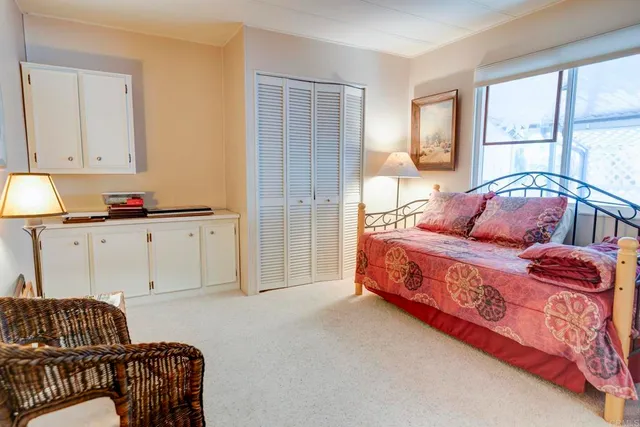 a bedroom with a bed and a couch