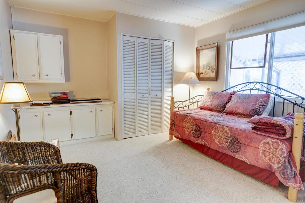 1010 Palm Canyon Drive, Unit 339 Borrego Springs, CA 92004 - Photo 14 of 19 a bedroom with a bed and a couch