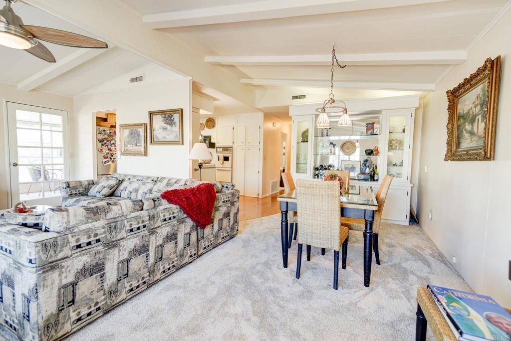 1010 Palm Canyon Drive, Unit 339 Borrego Springs, CA 92004 - Photo 2 of 19 a living room with furniture and a chandelier