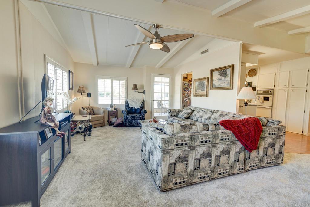 1010 Palm Canyon Drive, Unit 339 Borrego Springs, CA 92004 - Photo 3 of 19 a living room with furniture and a chandelier