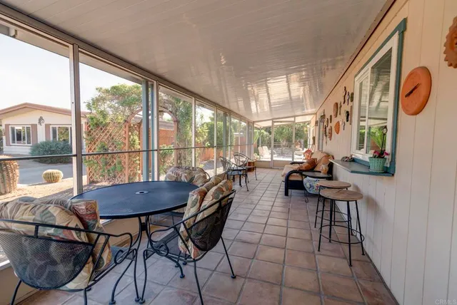 a view of a dining room with furniture window and outside view