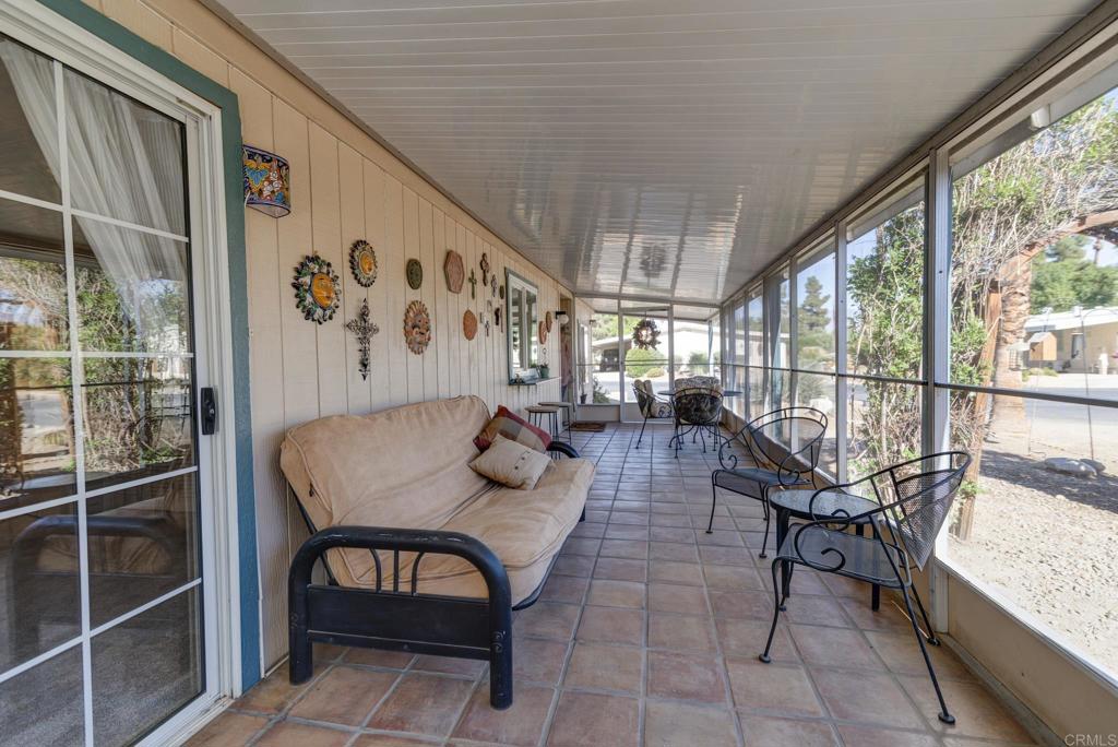 1010 Palm Canyon Drive, Unit 339 Borrego Springs, CA 92004 - Photo 8 of 19 a dining room with furniture and a floor to ceiling window