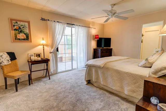 a bedroom with a bed and a chair