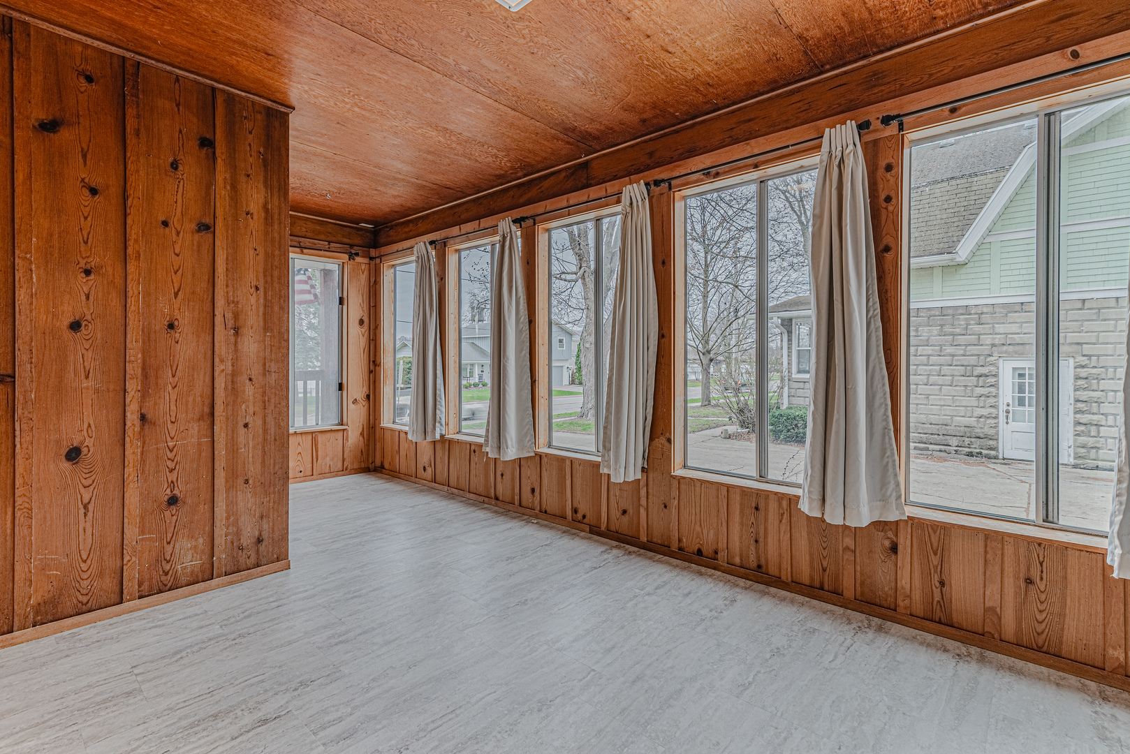1507 Riverside Drive McHenry, IL 60050 - Photo 14 of 27 a view of an empty room with wooden floor and windows