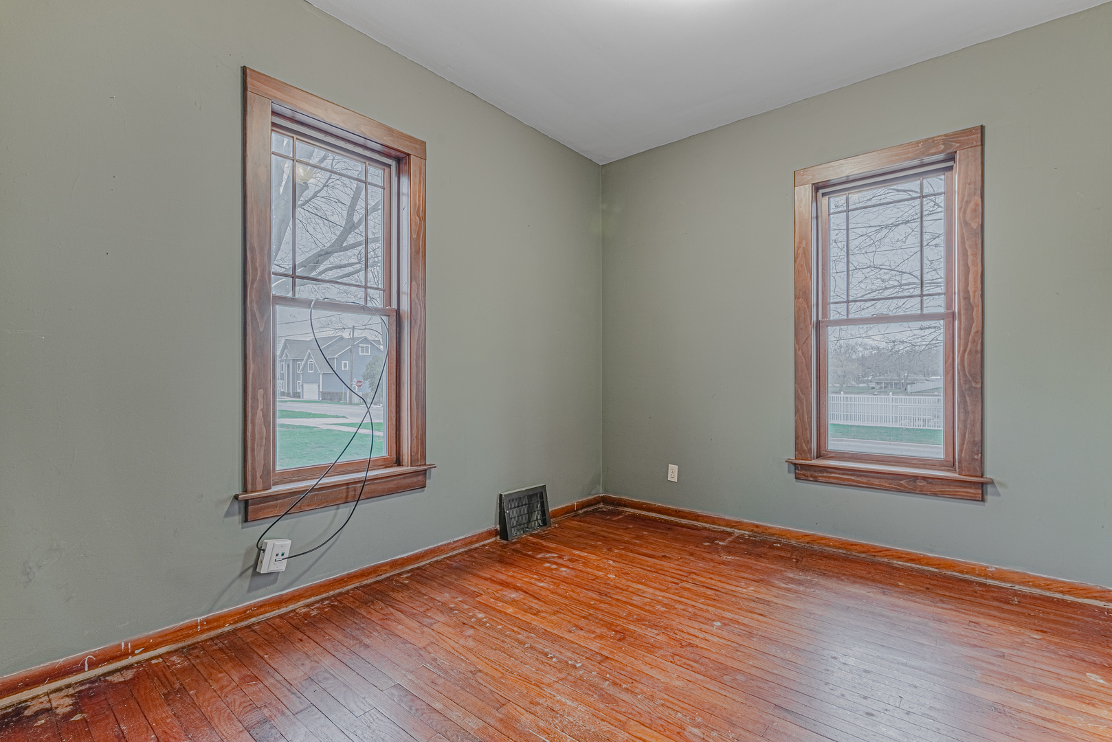 1507 Riverside Drive McHenry, IL 60050 - Photo 15 of 27 an empty room with wooden floor and windows
