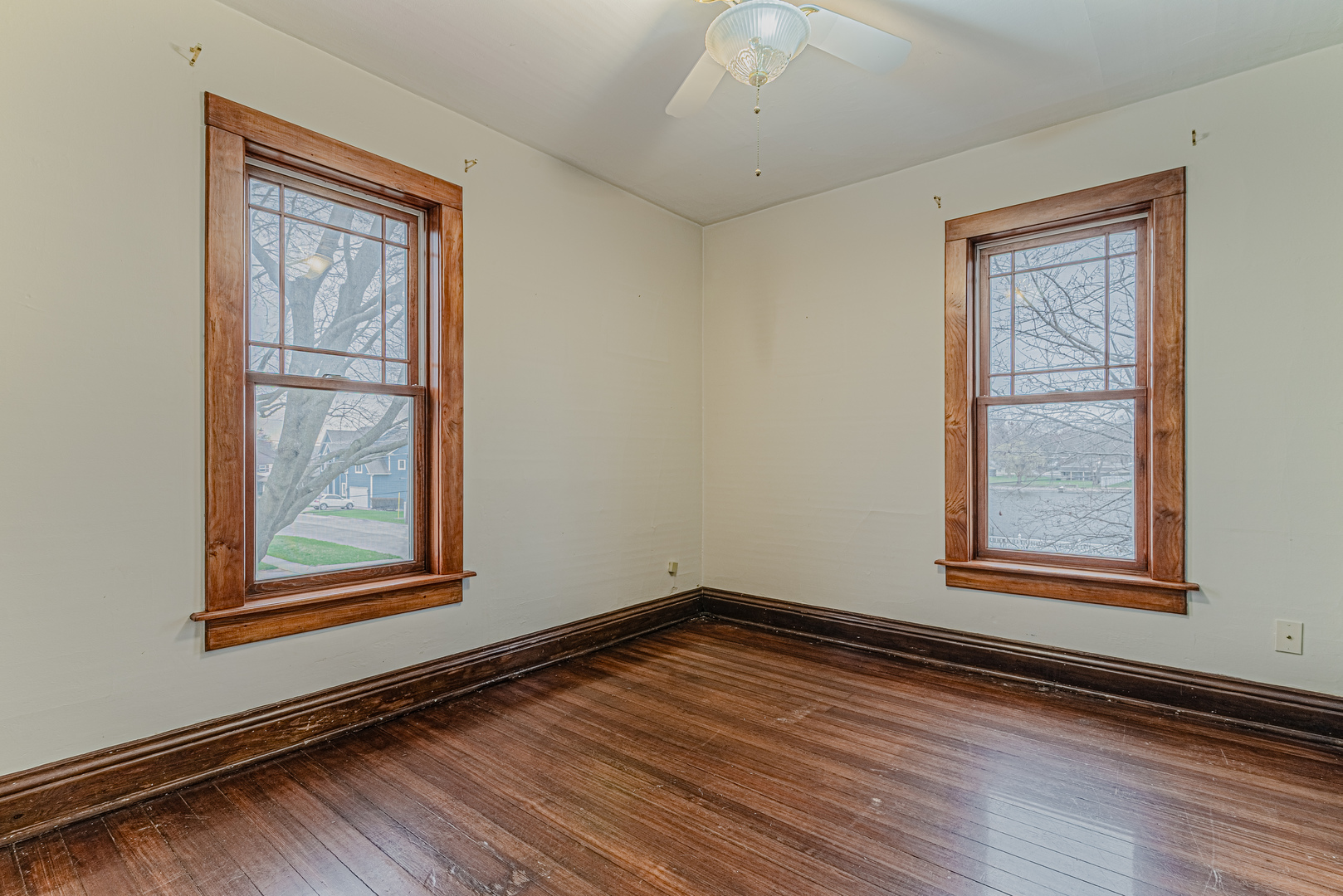 1507 Riverside Drive McHenry, IL 60050 - Photo 17 of 27 an empty room with wooden floor and windows