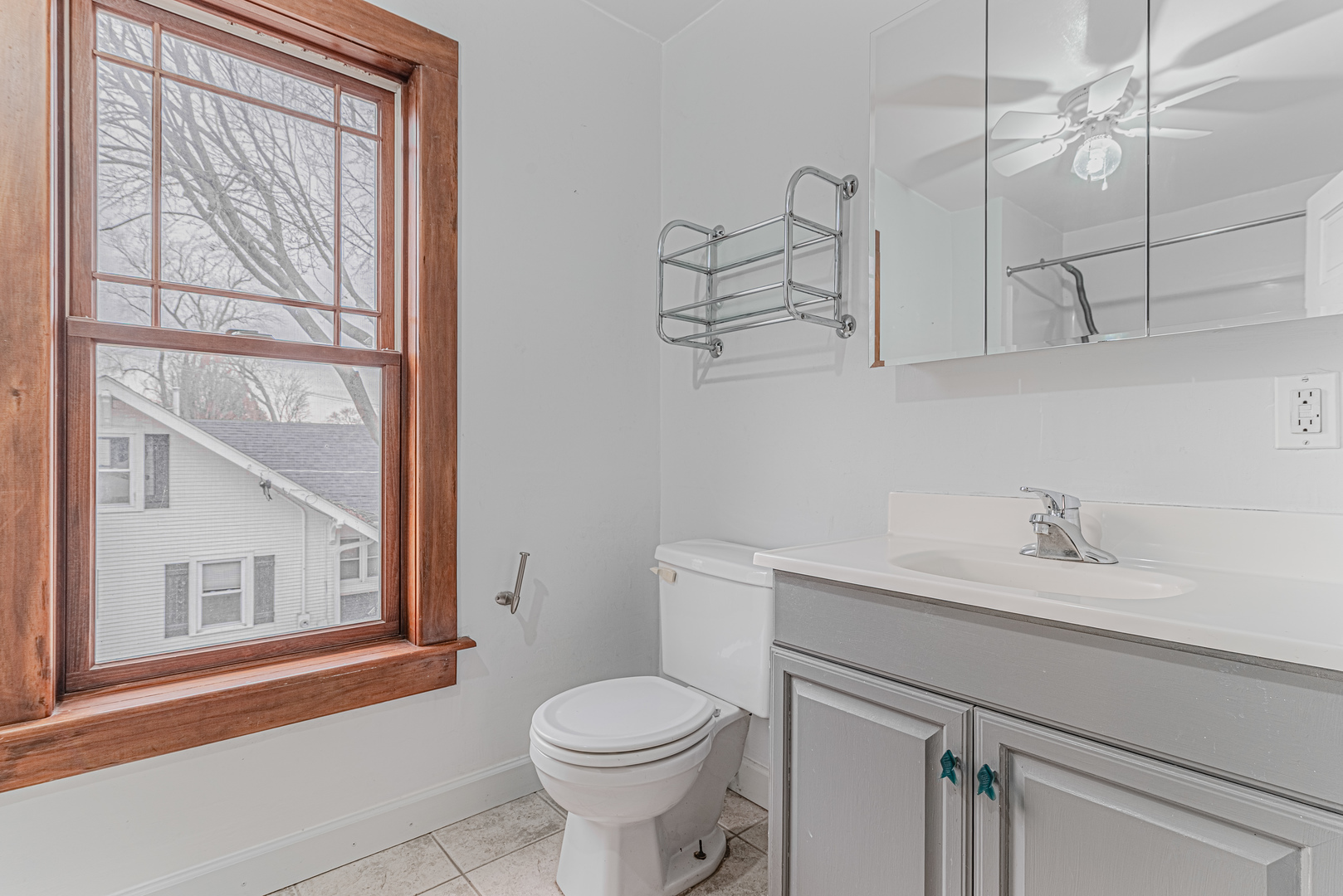 1507 Riverside Drive McHenry, IL 60050 - Photo 21 of 27 a bathroom with a sink vanity mirror and toilet