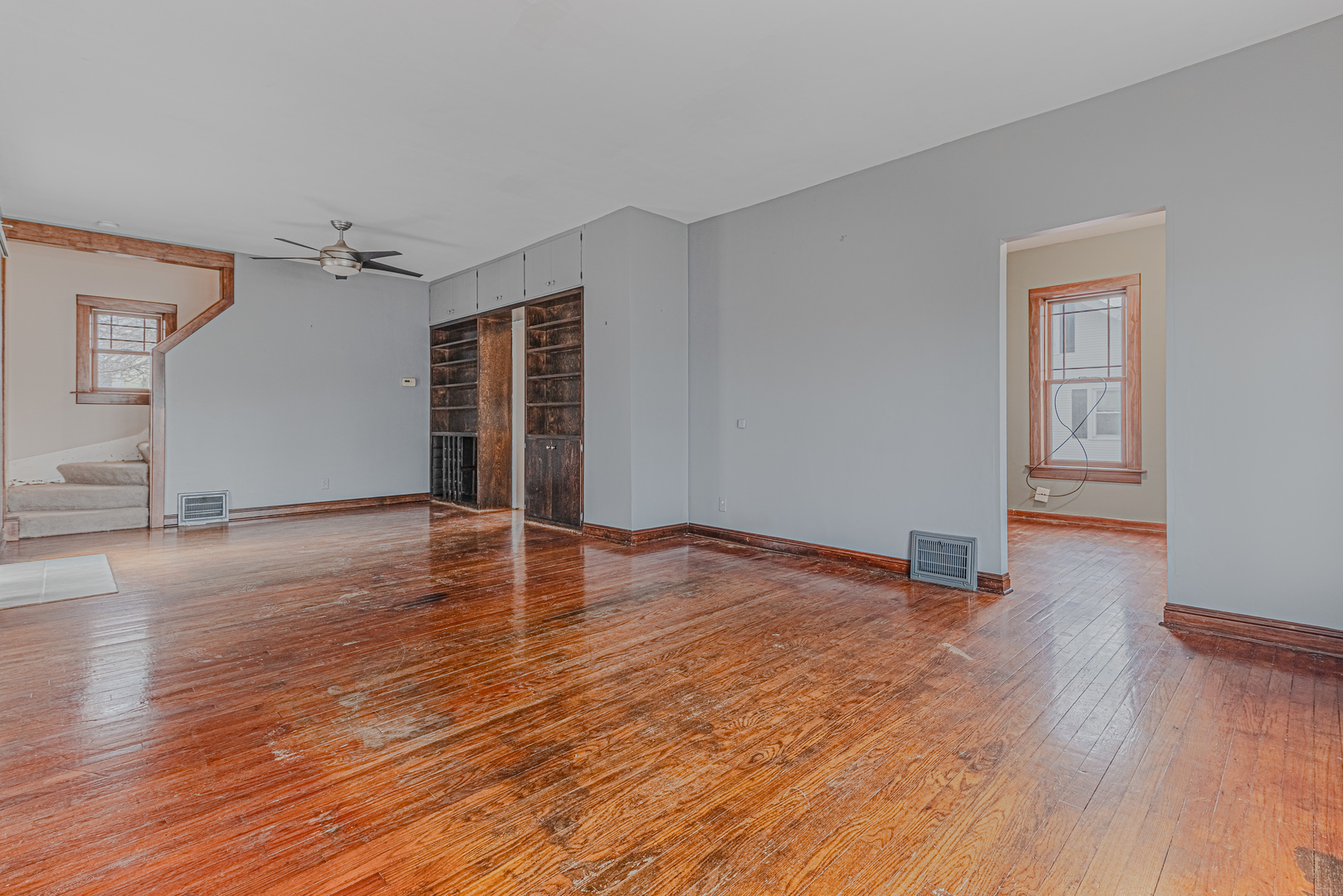 1507 Riverside Drive McHenry, IL 60050 - Photo 8 of 27 a view of empty room with wooden floor and fan