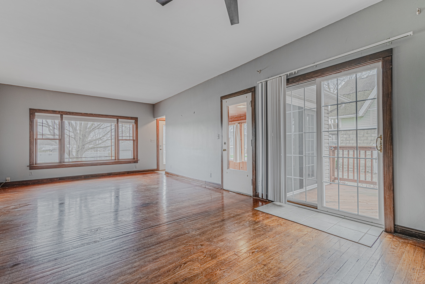 1507 Riverside Drive McHenry, IL 60050 - Photo 10 of 27 an empty room with wooden floor and windows