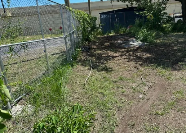 a backyard of a house with lots of green space