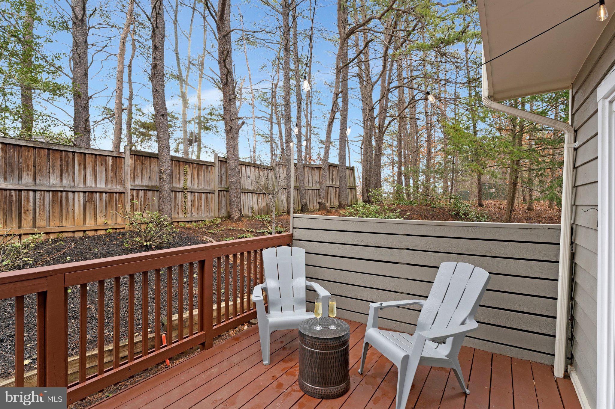 11123 Lakespray Way Reston, VA 20191 - Photo 15 of 47 a view of balcony with wooden floor and outdoor seating