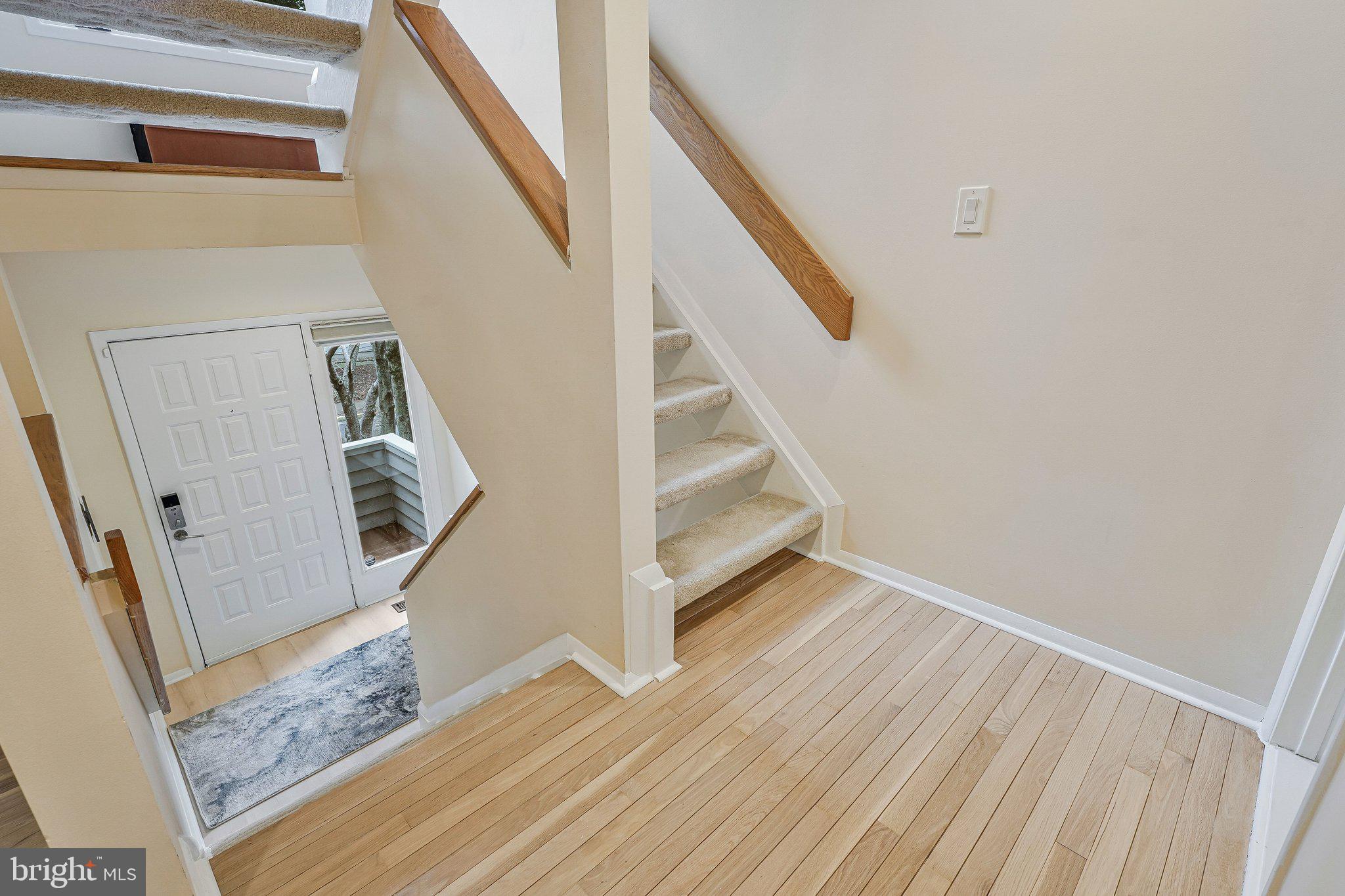11123 Lakespray Way Reston, VA 20191 - Photo 19 of 47 a view of entryway and hall with wooden floor