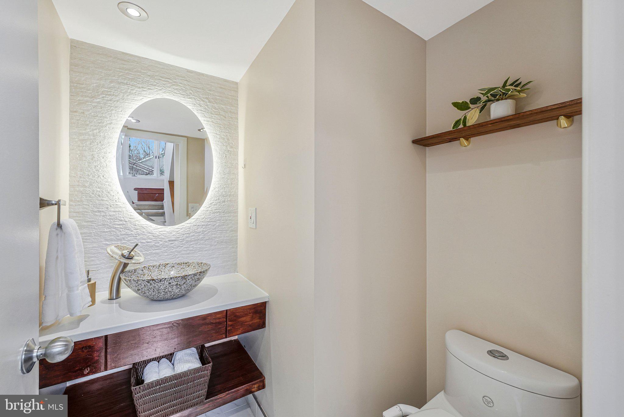 11123 Lakespray Way Reston, VA 20191 - Photo 22 of 47 a front view of a house with a table and chair