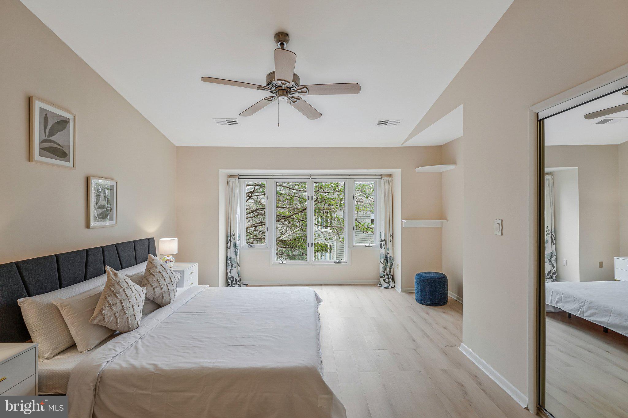 11123 Lakespray Way Reston, VA 20191 - Photo 23 of 47 a bedroom with a bed and wooden floor