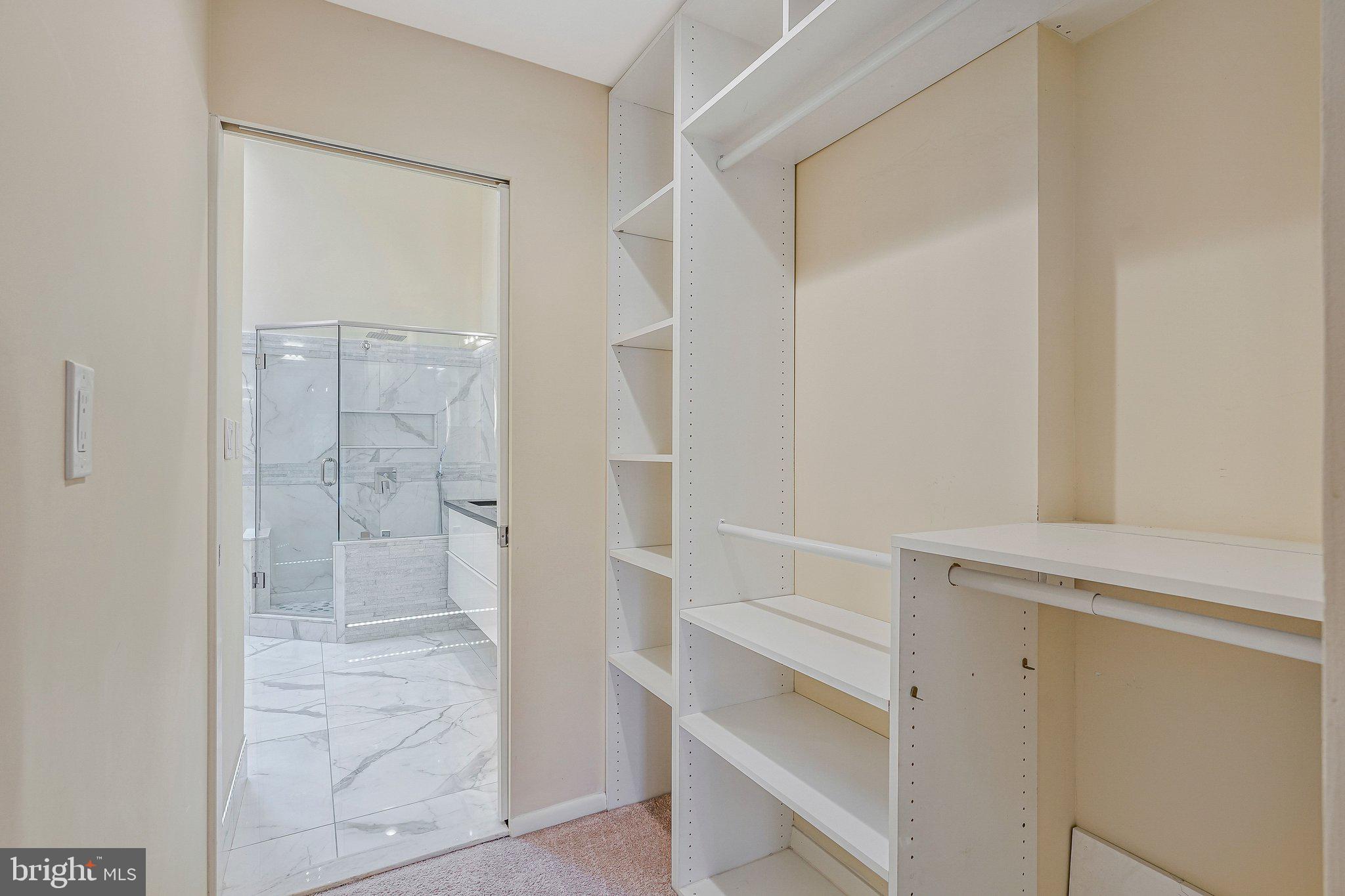 11123 Lakespray Way Reston, VA 20191 - Photo 26 of 47 a view of an empty walk in closet
