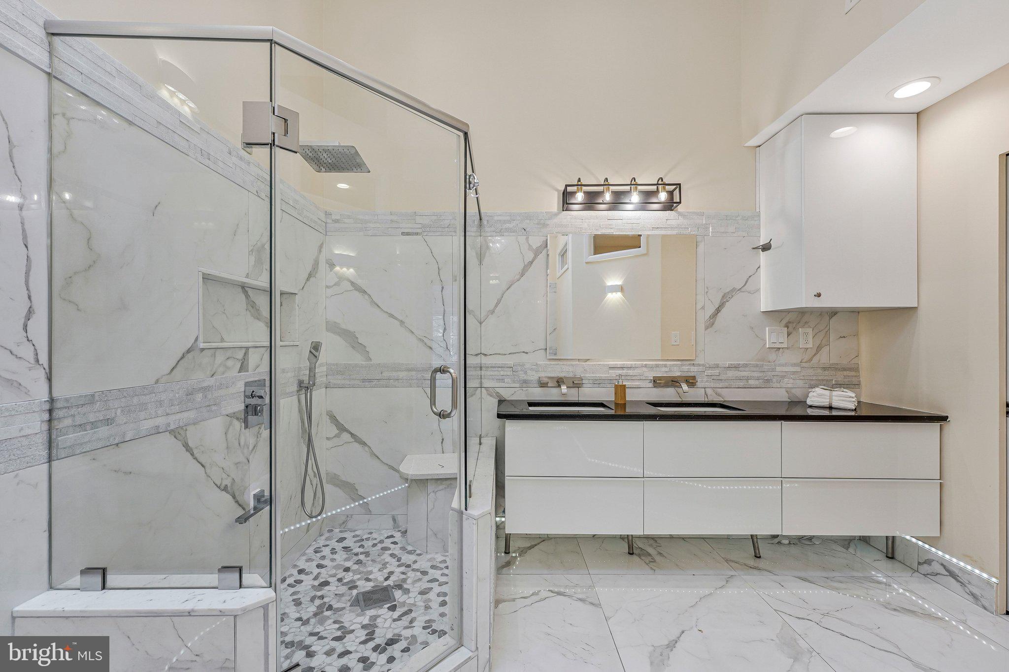 11123 Lakespray Way Reston, VA 20191 - Photo 27 of 47 a bath room with a sink and a mirror