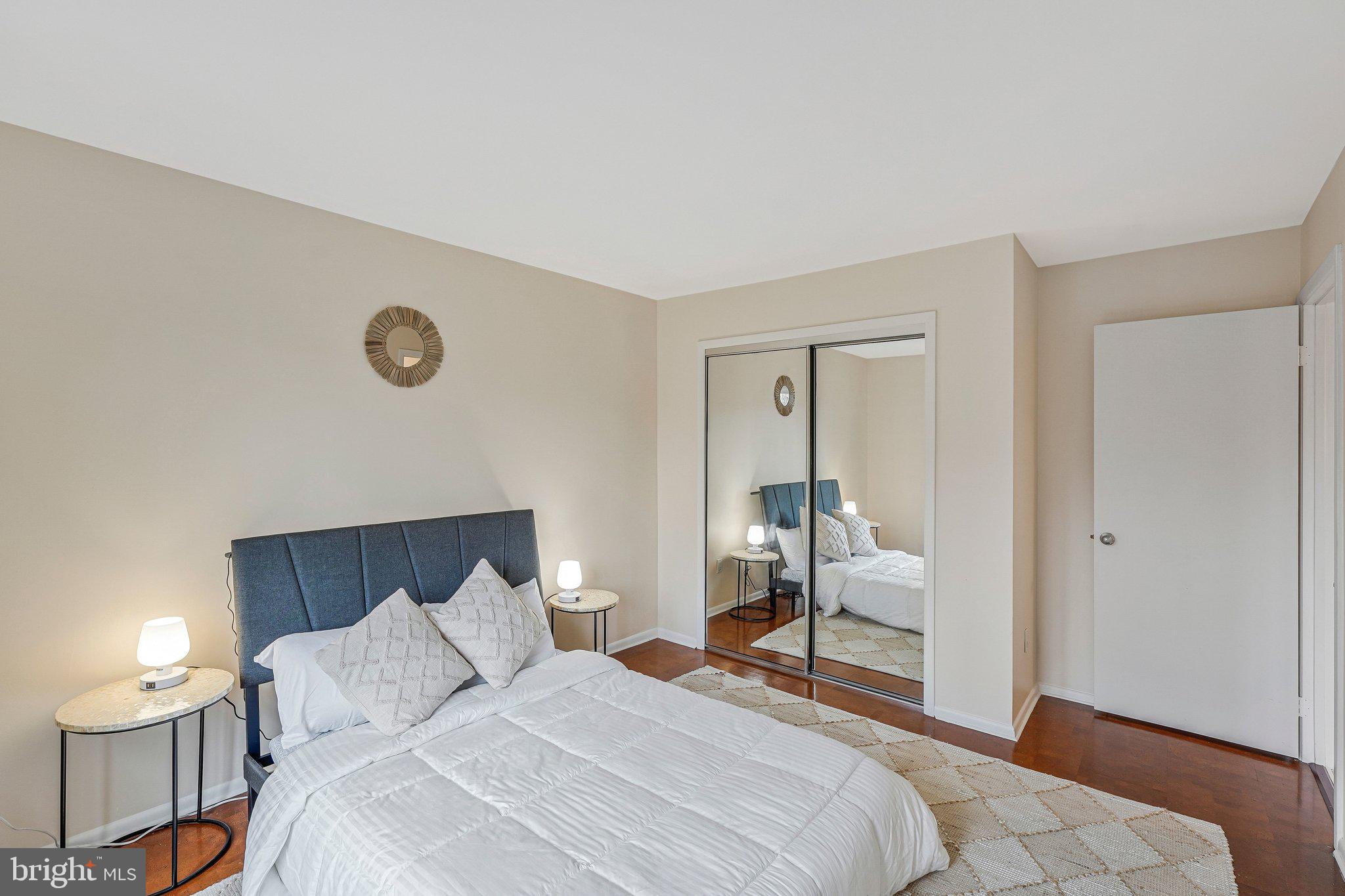 11123 Lakespray Way Reston, VA 20191 - Photo 31 of 47 a bedroom with a bed and a chair