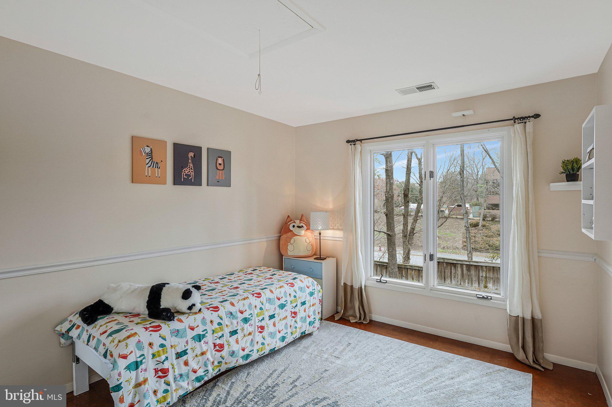 11123 Lakespray Way Reston, VA 20191 - Photo 33 of 47 a bedroom with bed and wooden floor