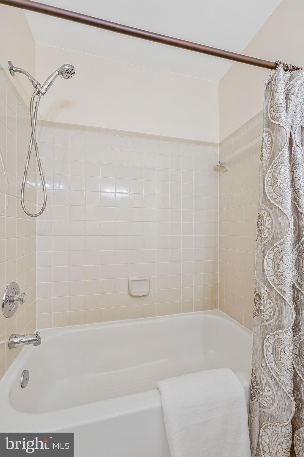 11123 Lakespray Way Reston, VA 20191 - Photo 36 of 47 a bathroom with a bathtub and shower