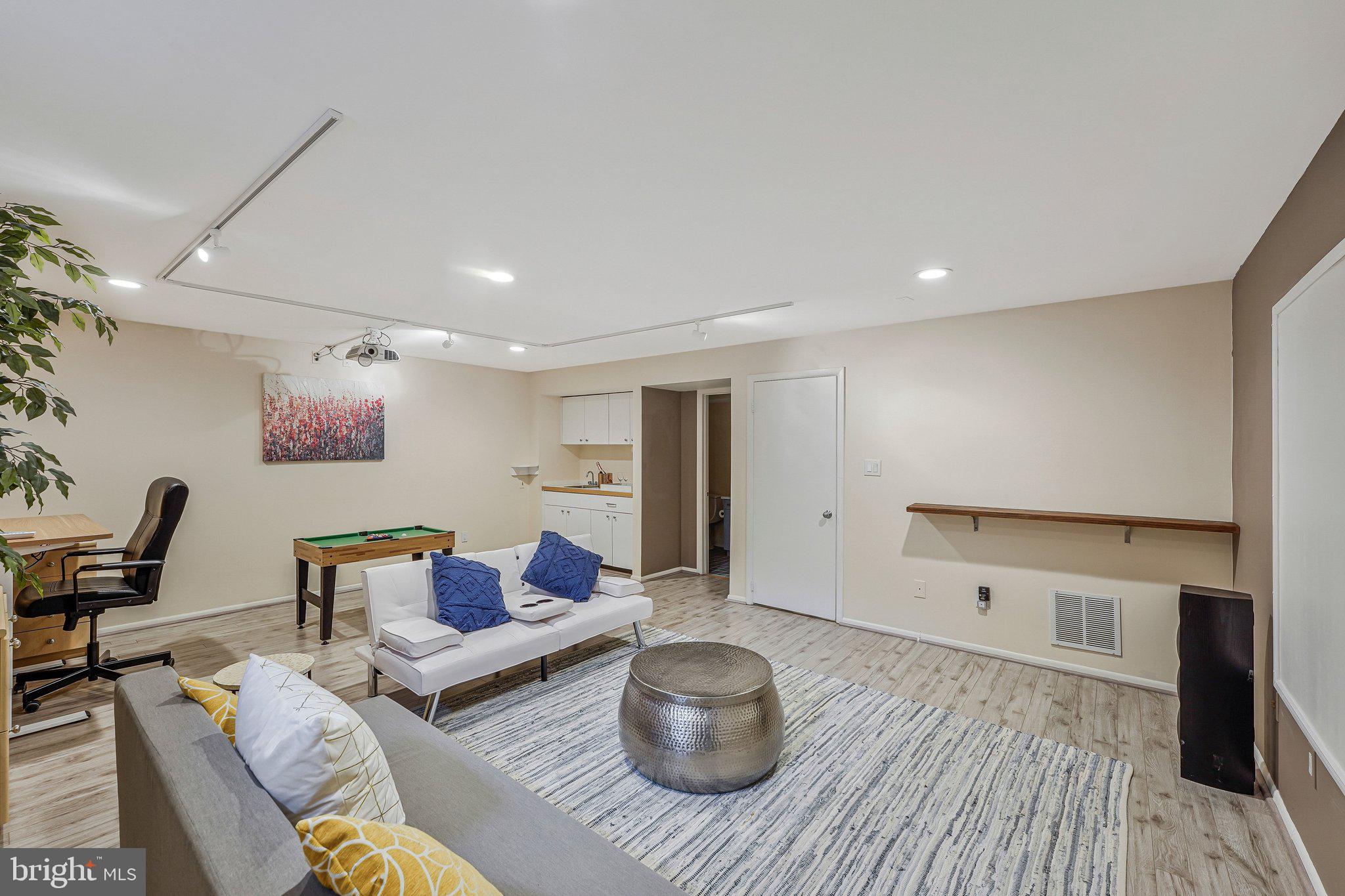 11123 Lakespray Way Reston, VA 20191 - Photo 38 of 47 a living room with furniture and wooden floor