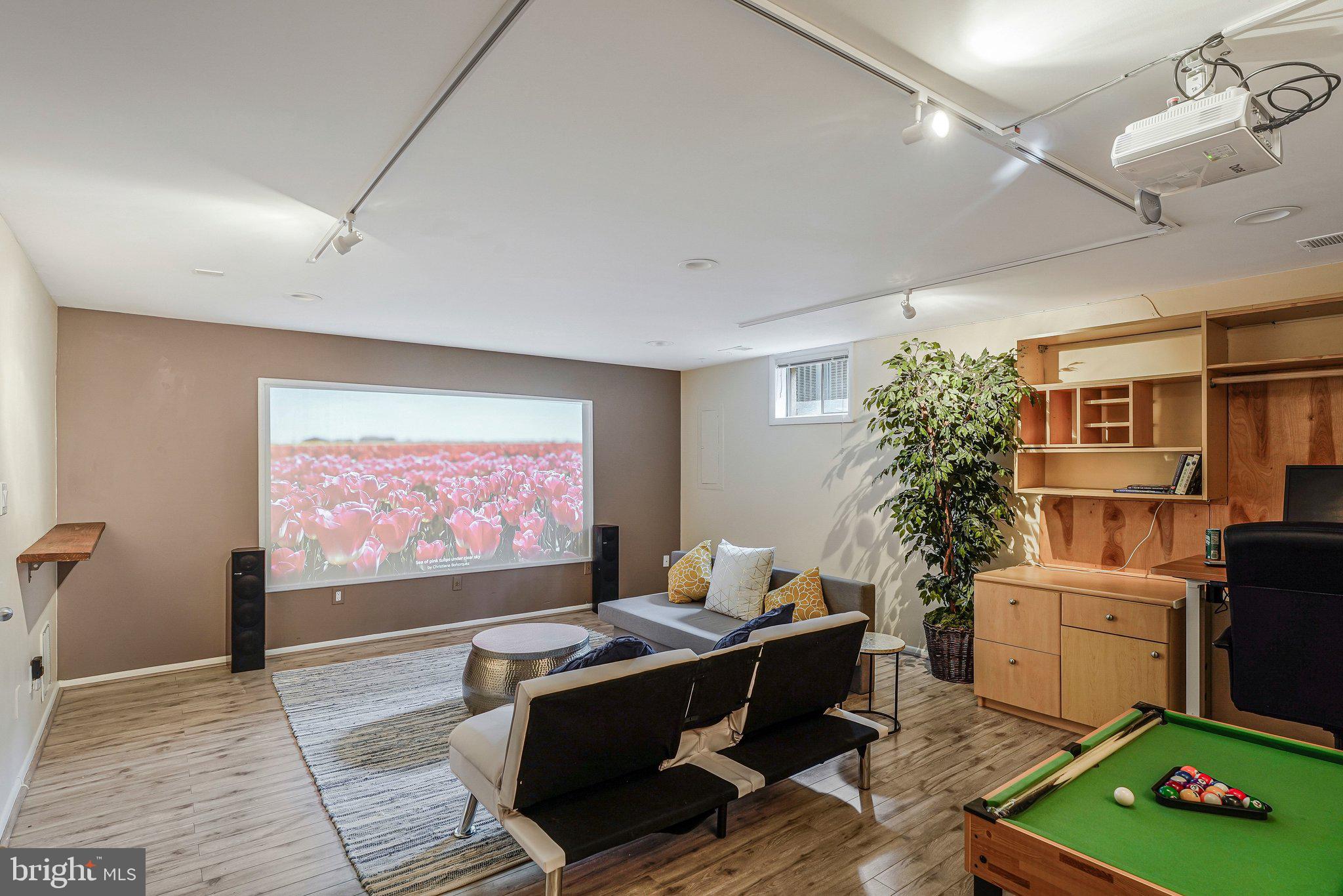 11123 Lakespray Way Reston, VA 20191 - Photo 4 of 47 a living room with furniture a rug and a flat screen tv