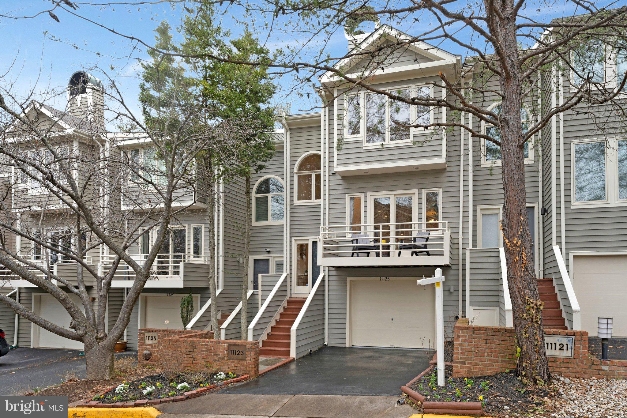 11123 Lakespray Way Reston, VA 20191 - Photo 7 of 47 a front view of a house with a tree